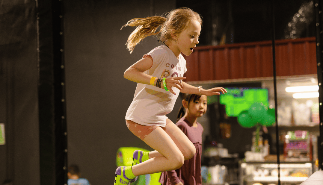 Girl Jumping in a Flip Out trampoline park