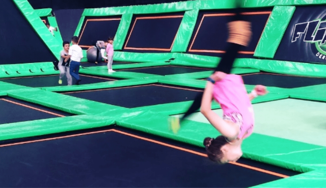 A girl flipping in trampoline park | Flip Out Australia