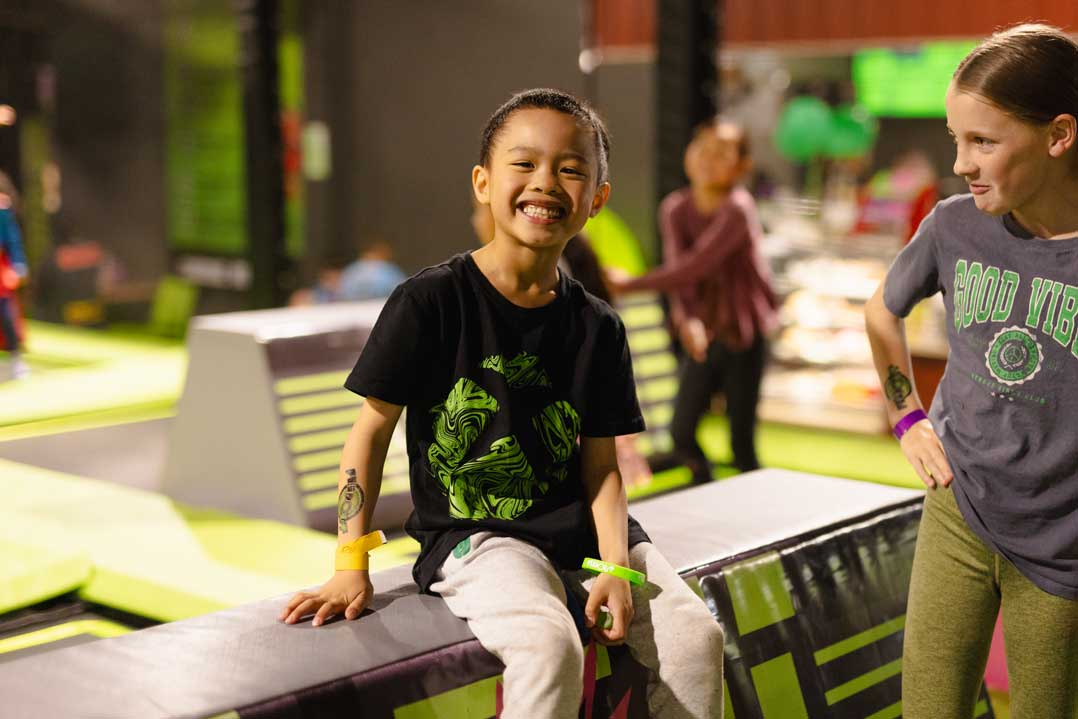 A Girl Smiling on a Trampoline Park | Flip Out Australia